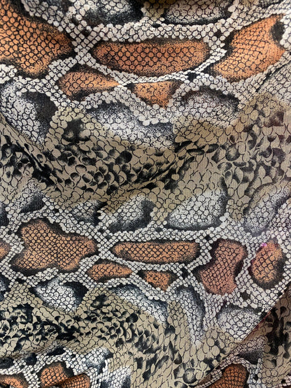 New exotic snake design taupe/black print on stretch mesh 4-way 58/60” Sold by the YD. Ships worldwide from Los Angeles California USA.