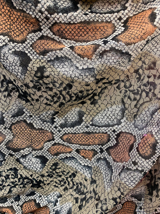 New exotic snake design taupe/black print on stretch mesh 4-way 58/60” Sold by the YD. Ships worldwide from Los Angeles California USA.