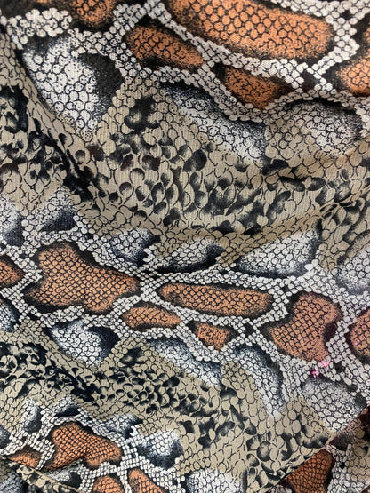 New exotic snake design taupe/black print on stretch mesh 4-way 58/60” Sold by the YD. Ships worldwide from Los Angeles California USA.