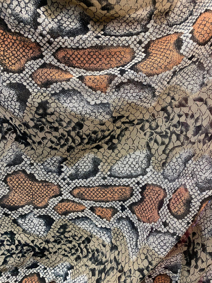 New exotic snake design taupe/black print on stretch mesh 4-way 58/60” Sold by the YD. Ships worldwide from Los Angeles California USA.