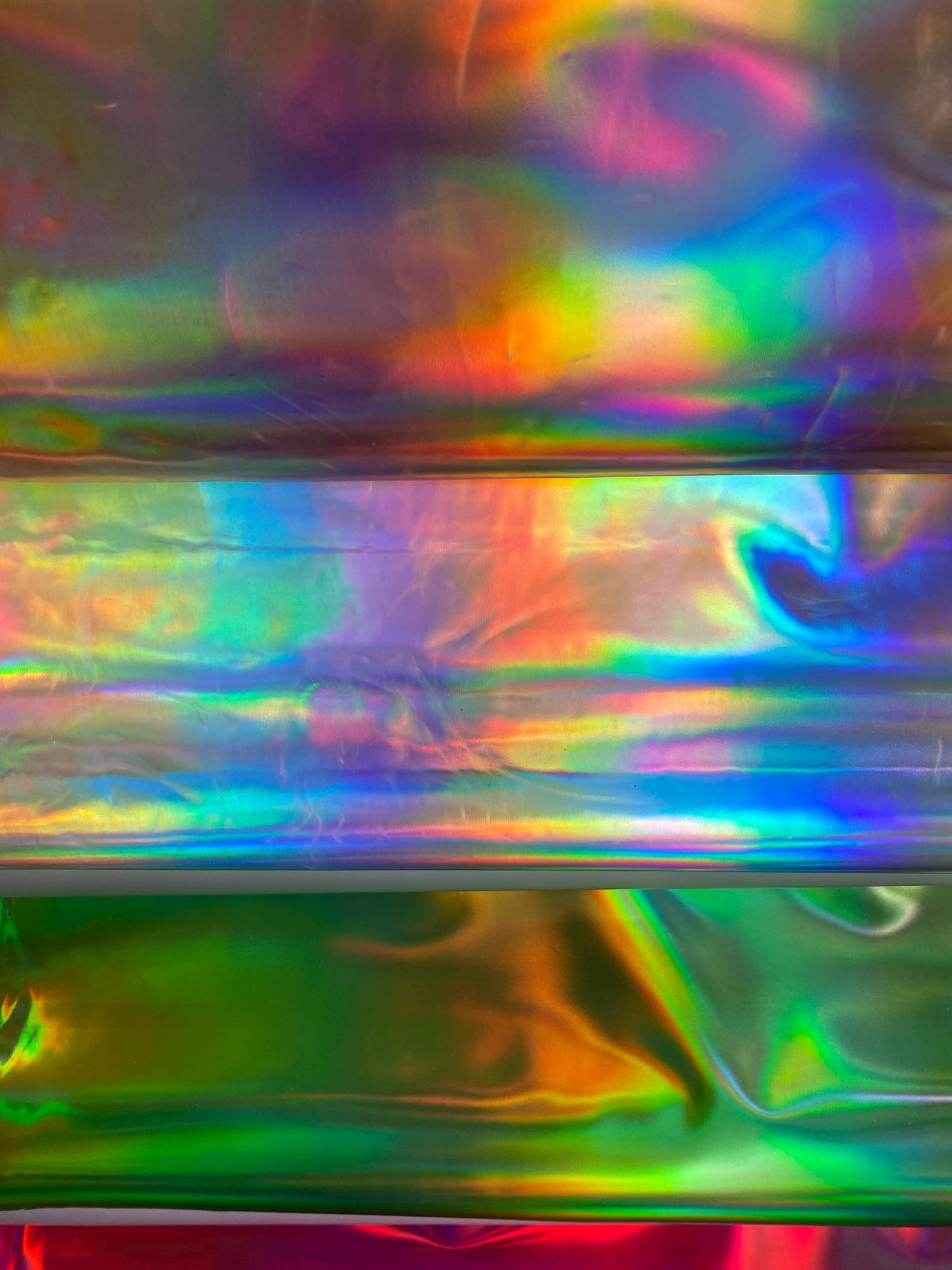 New Luxury Iridescent vinyl medium weight 2-way stretch 58/60”Sold by the YD. Ships worldwide from Los Angeles California USA.