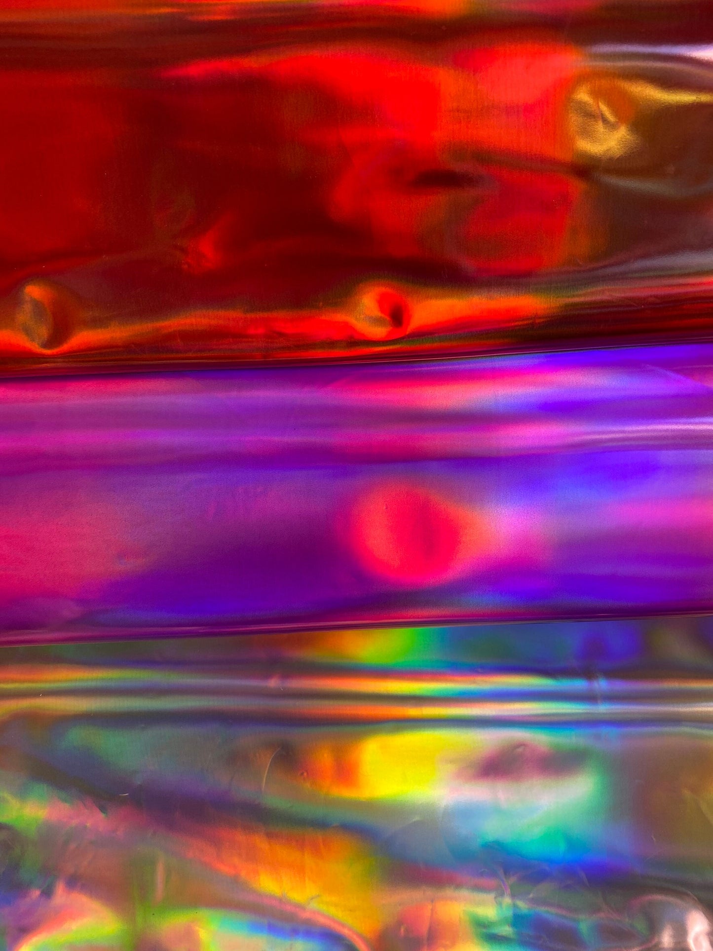 New Luxury Iridescent vinyl medium weight 2-way stretch 58/60”Sold by the YD. Ships worldwide from Los Angeles California USA.