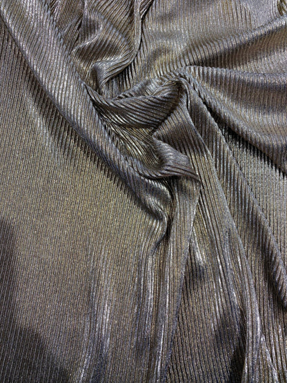 New metallic poly pleated black/gold medium weight fabric 2-way stretch 58/60” Sold by the YD. Ships worldwide from Los Angeles CA USA.