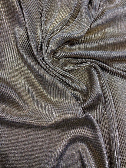 New metallic poly pleated black/gold medium weight fabric 2-way stretch 58/60” Sold by the YD. Ships worldwide from Los Angeles CA USA.