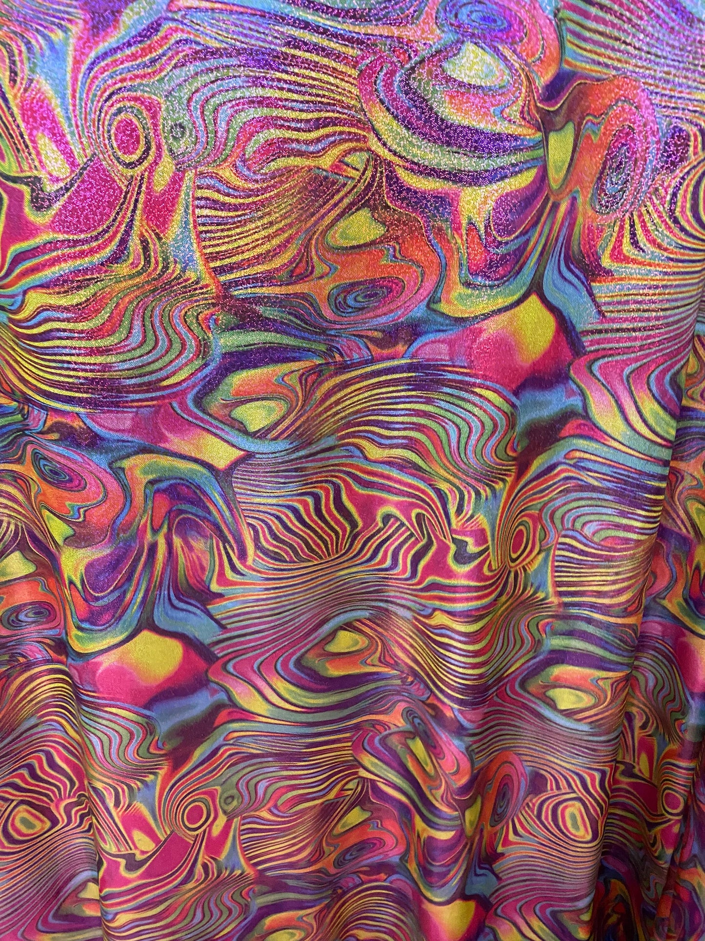 New lava design multicolor print on nylon spandex with foggy foil all over 4-way stretch 58/60” Sold by the YD. Ships worldwide from L.A CA.