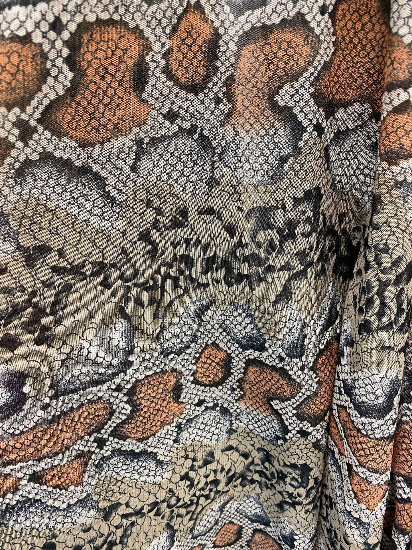 Exotic snake design Nude/black 2-tone print on stretch mesh 4-way 58/60” Sold by the YD. Ships worldwide from Los Angeles California USA.