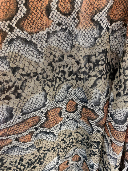 Exotic snake design Nude/black 2-tone print on stretch mesh 4-way 58/60” Sold by the YD. Ships worldwide from Los Angeles California USA.