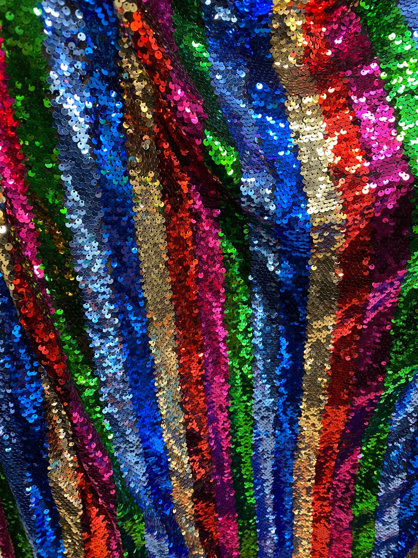 New stripe design rainbow sequins multicolor on stretch mesh 2-way 55/57” Sold by the YD. Ships worldwide from Los Angeles California USA.