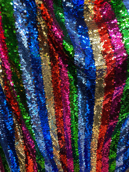 New stripe design rainbow sequins multicolor on stretch mesh 2-way 55/57” Sold by the YD. Ships worldwide from Los Angeles California USA.
