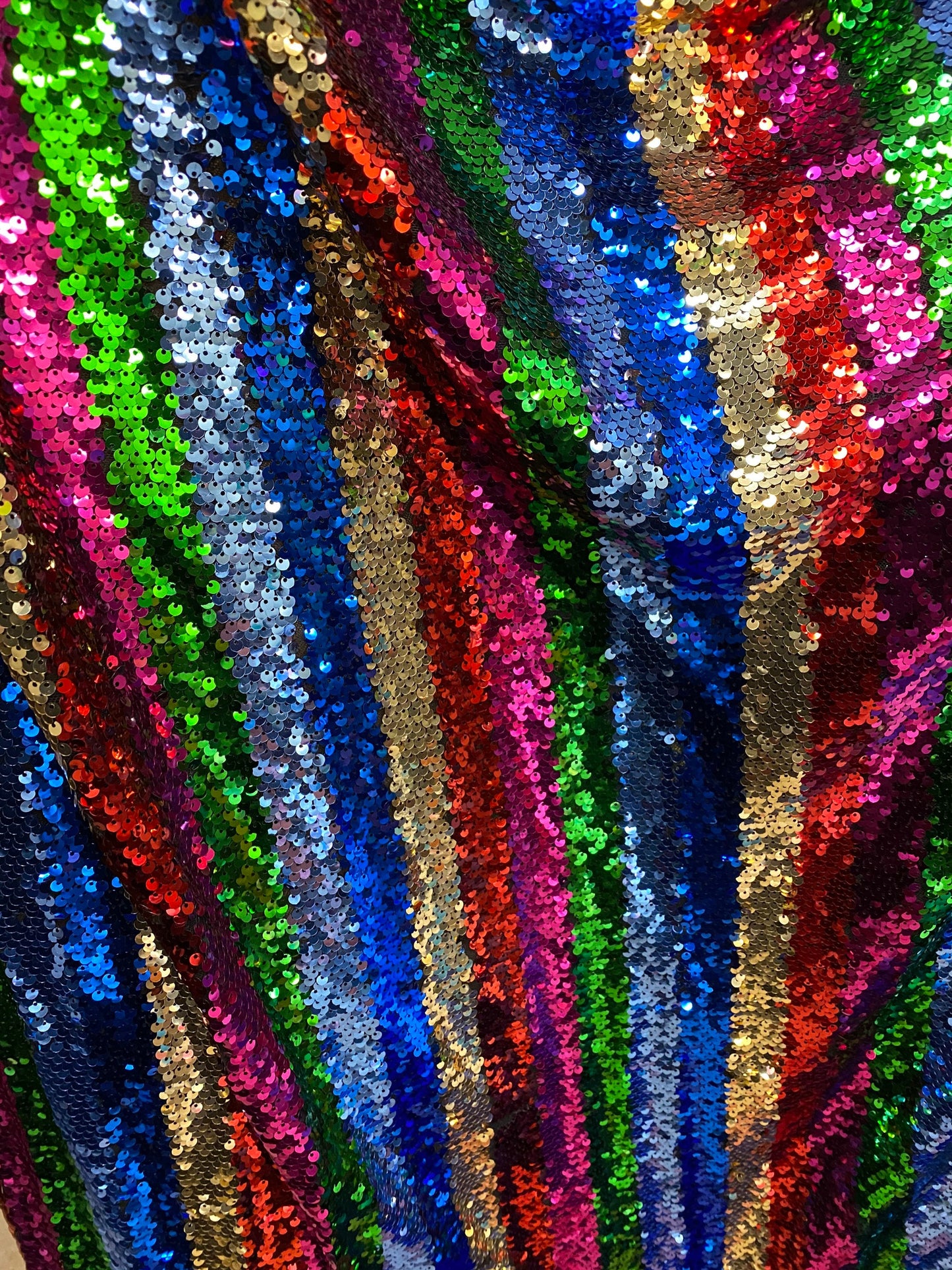 New stripe design rainbow sequins multicolor on stretch mesh 2-way 55/57” Sold by the YD. Ships worldwide from Los Angeles California USA.