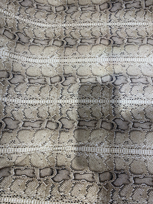 New exotic snake design taupe/black medium weight 4-way stretch 58/60” Sold by the YD. Ships worldwide from Los Angeles California USA.
