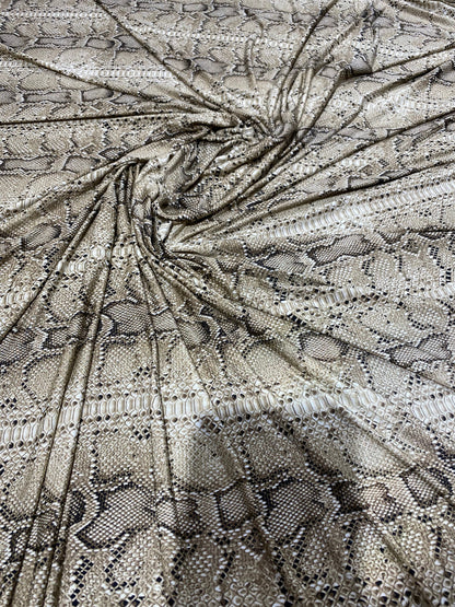 New exotic snake design taupe/black medium weight 4-way stretch 58/60” Sold by the YD. Ships worldwide from Los Angeles California USA.