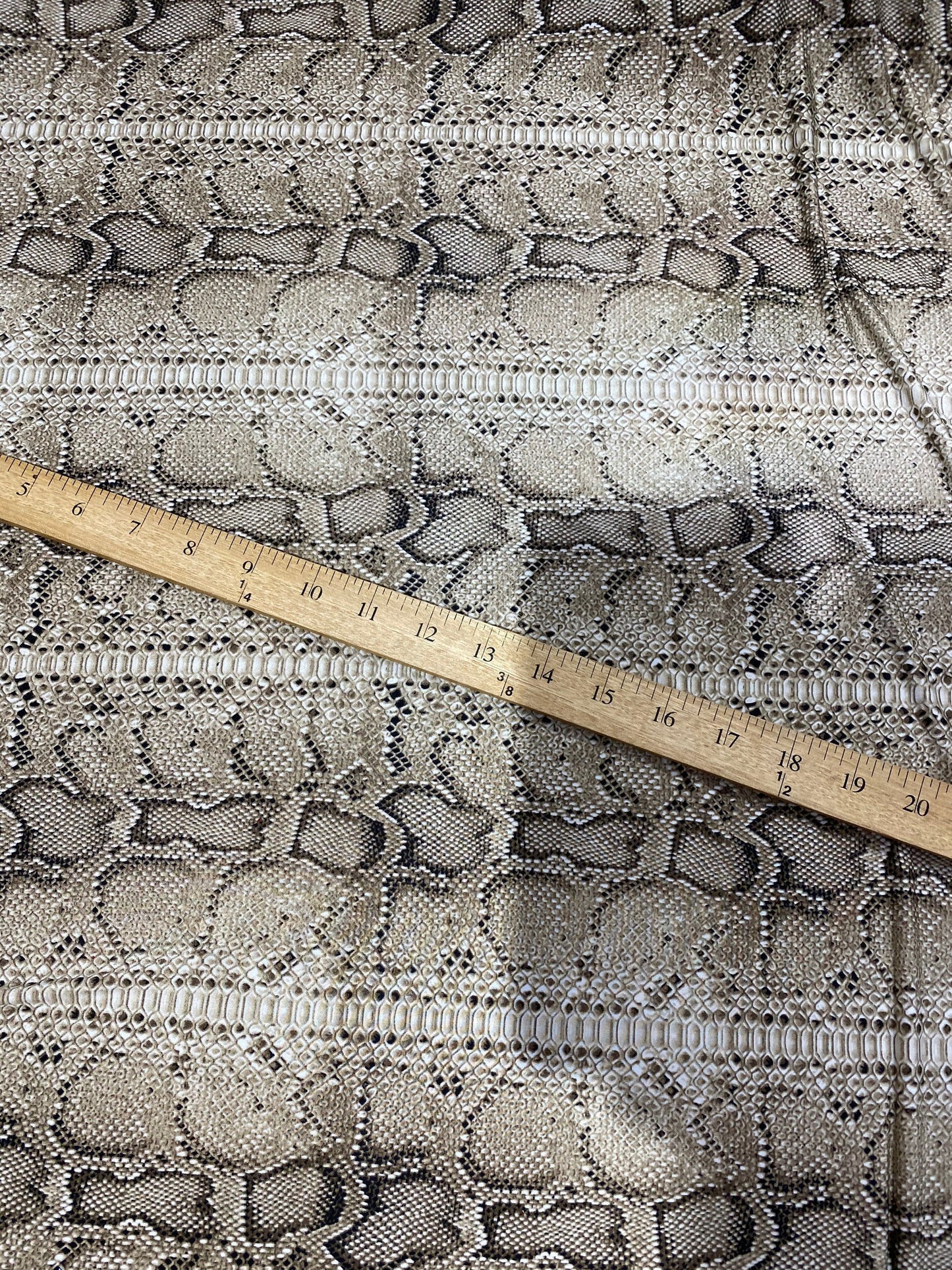 New exotic snake design taupe/black medium weight 4-way stretch 58/60” Sold by the YD. Ships worldwide from Los Angeles California USA.