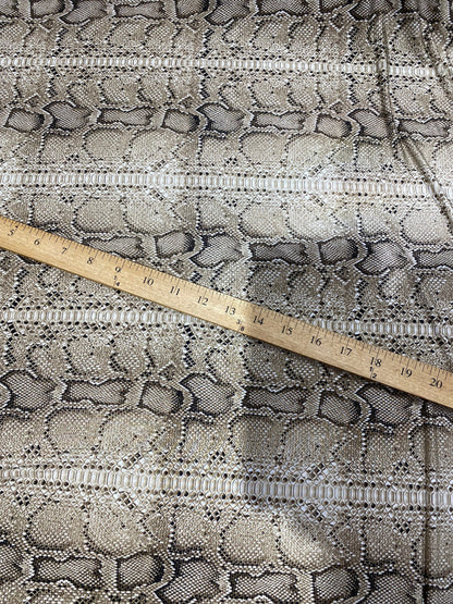 New exotic snake design taupe/black medium weight 4-way stretch 58/60” Sold by the YD. Ships worldwide from Los Angeles California USA.