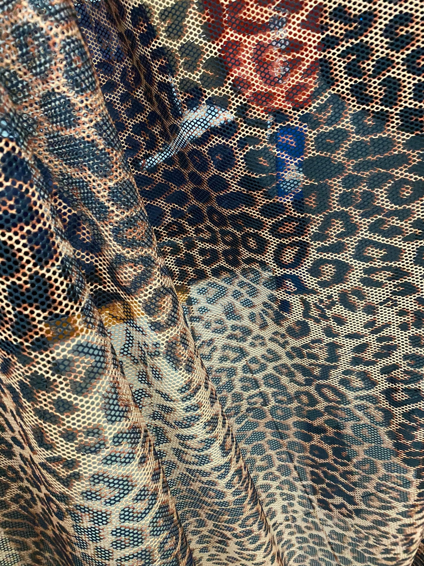 New fishnet exotic leopard design 2-way stretch 58/60” Sold by the YD. Ships worldwide from Los Angeles California USA.