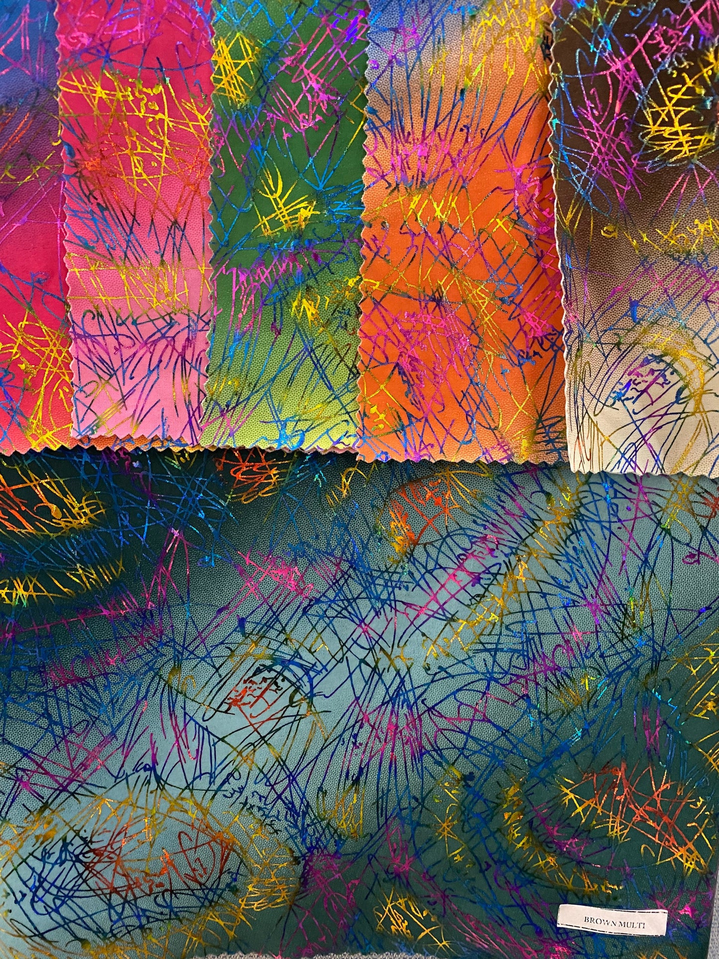 New tie dye Bang bang hologram foil print in nylon spandex 4way stretch 58/60” Sold by the YD. Ships worldwide from Los Angeles CA.