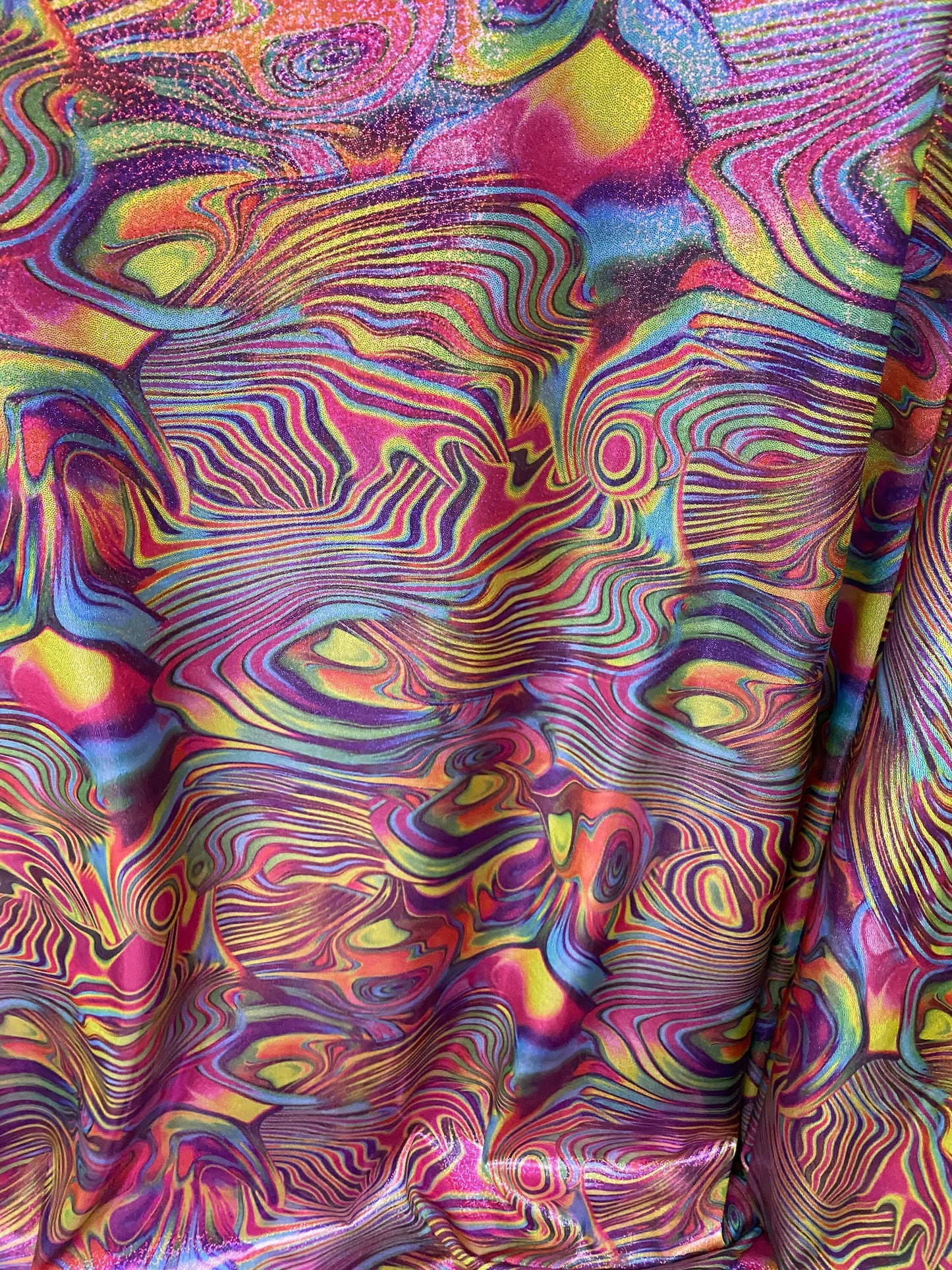 New lava design multicolor print on nylon spandex with foggy foil all over 4-way stretch 58/60” Sold by the YD. Ships worldwide from L.A CA.