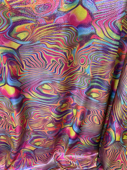New lava design multicolor print on nylon spandex with foggy foil all over 4-way stretch 58/60” Sold by the YD. Ships worldwide from L.A CA.