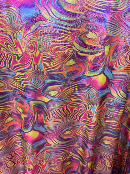New lava design multicolor print on nylon spandex with foggy foil all over 4-way stretch 58/60” Sold by the YD. Ships worldwide from L.A CA.