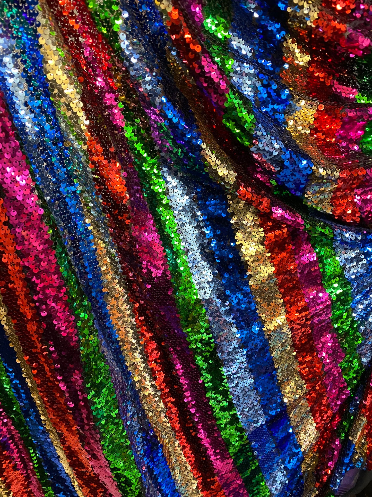 New stripe design rainbow sequins multicolor on stretch mesh 2-way 55/57” Sold by the YD. Ships worldwide from Los Angeles California USA.