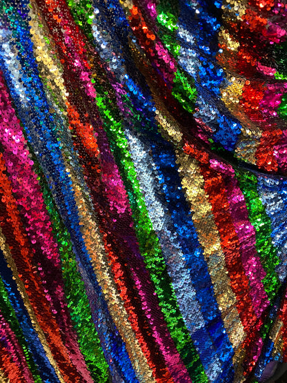 New stripe design rainbow sequins multicolor on stretch mesh 2-way 55/57” Sold by the YD. Ships worldwide from Los Angeles California USA.