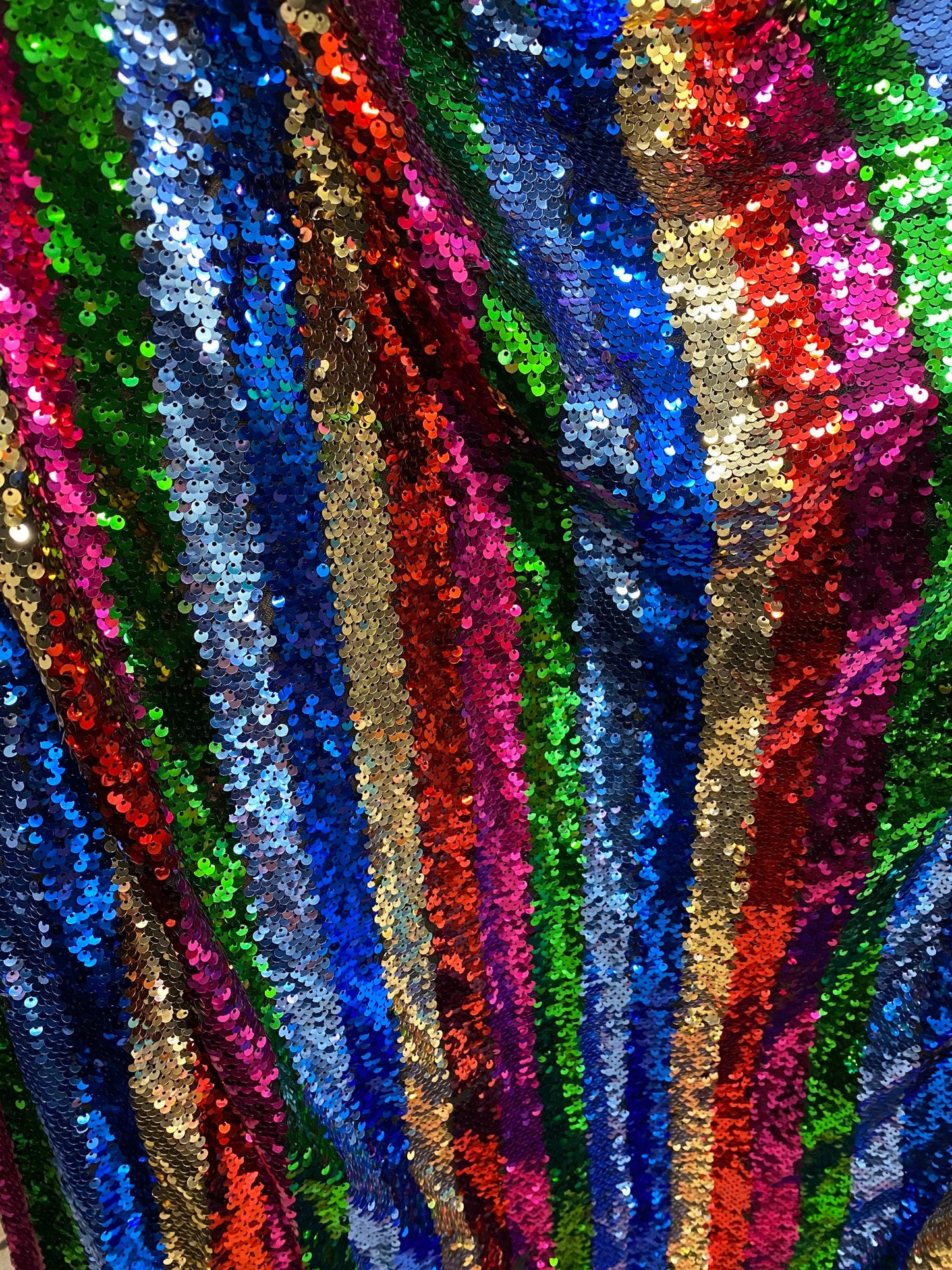 New stripe design rainbow sequins multicolor on stretch mesh 2-way 55/57” Sold by the YD. Ships worldwide from Los Angeles California USA.