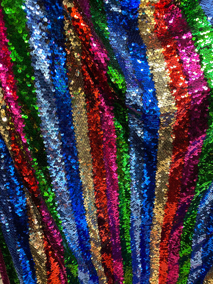 New stripe design rainbow sequins multicolor on stretch mesh 2-way 55/57” Sold by the YD. Ships worldwide from Los Angeles California USA.