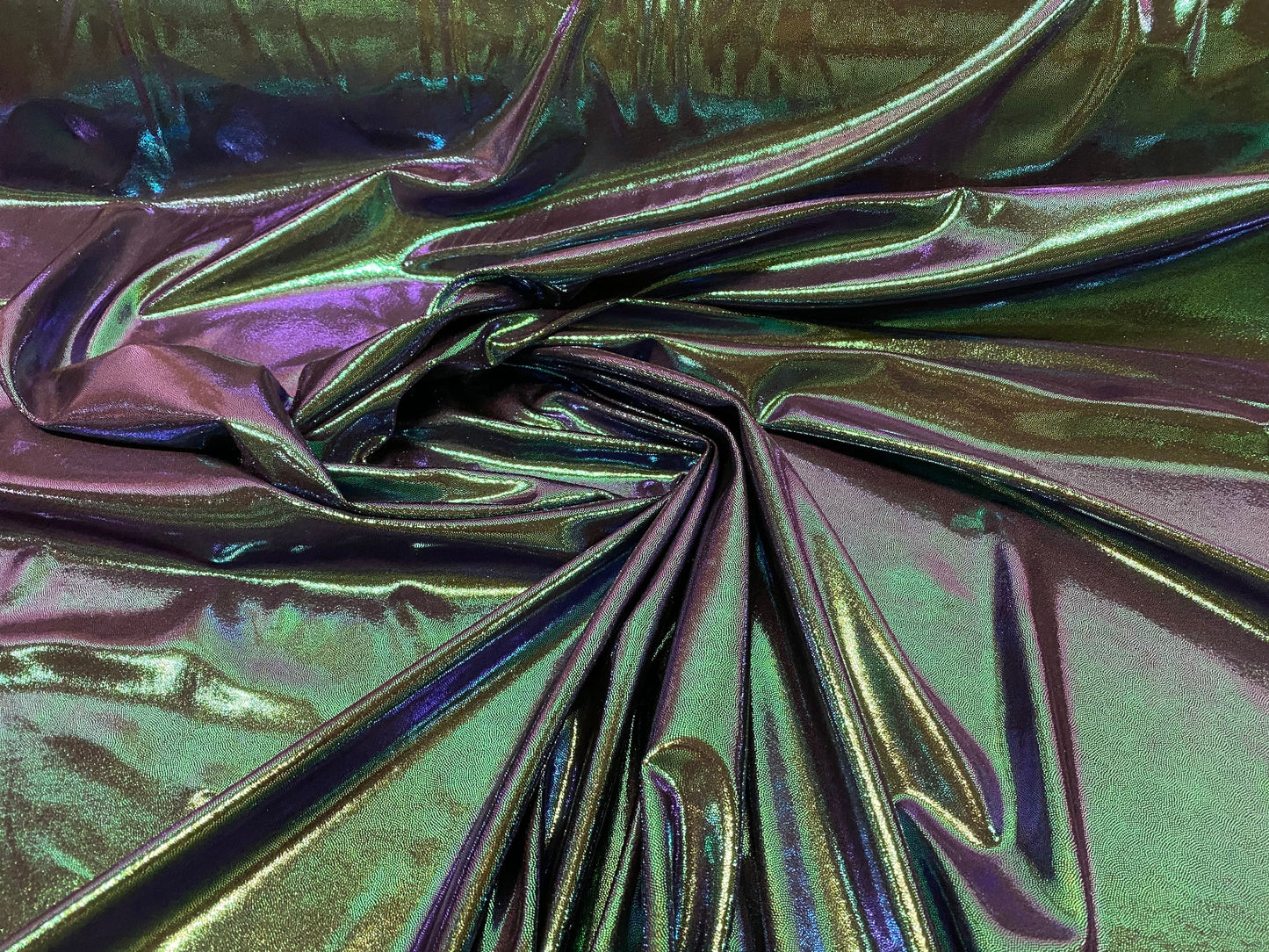 New oil slick iridescent blue green hologram metallic nylon spandex  4-way stretch 58/60” Sold by the YD. Ships worldwide from L.A