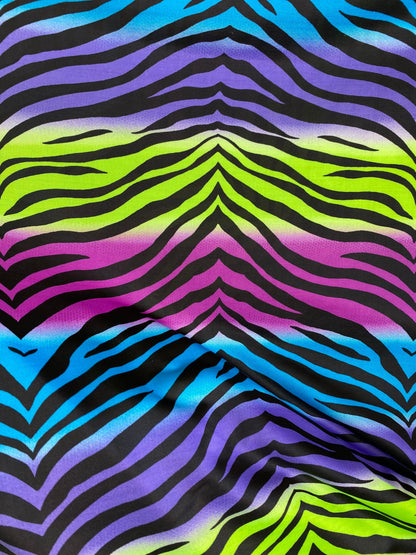 New zebra design rainbow neon green multi poly spandex 4-way stretch medium weight 58/60” Sold by the YD. Ships worldwide from Los Angeles