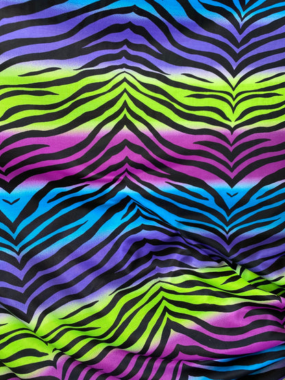 New zebra design rainbow neon green multi poly spandex 4-way stretch medium weight 58/60” Sold by the YD. Ships worldwide from Los Angeles