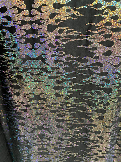 New hologram flames design metallic poly spandex black/silver 2-way stretch 58/60” Sold by the YD. Ships worldwide from Los Angeles CA USA.