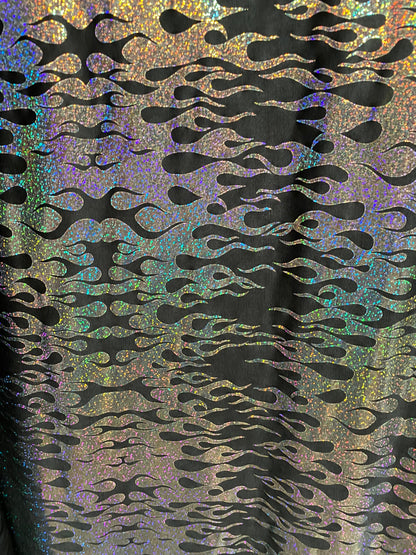 New hologram flames design metallic poly spandex black/silver 2-way stretch 58/60” Sold by the YD. Ships worldwide from Los Angeles CA USA.