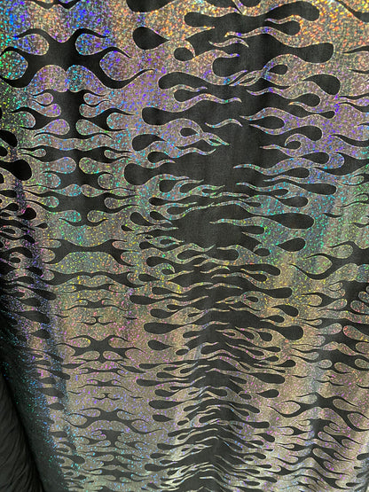 New hologram flames design metallic poly spandex black/silver 2-way stretch 58/60” Sold by the YD. Ships worldwide from Los Angeles CA USA.