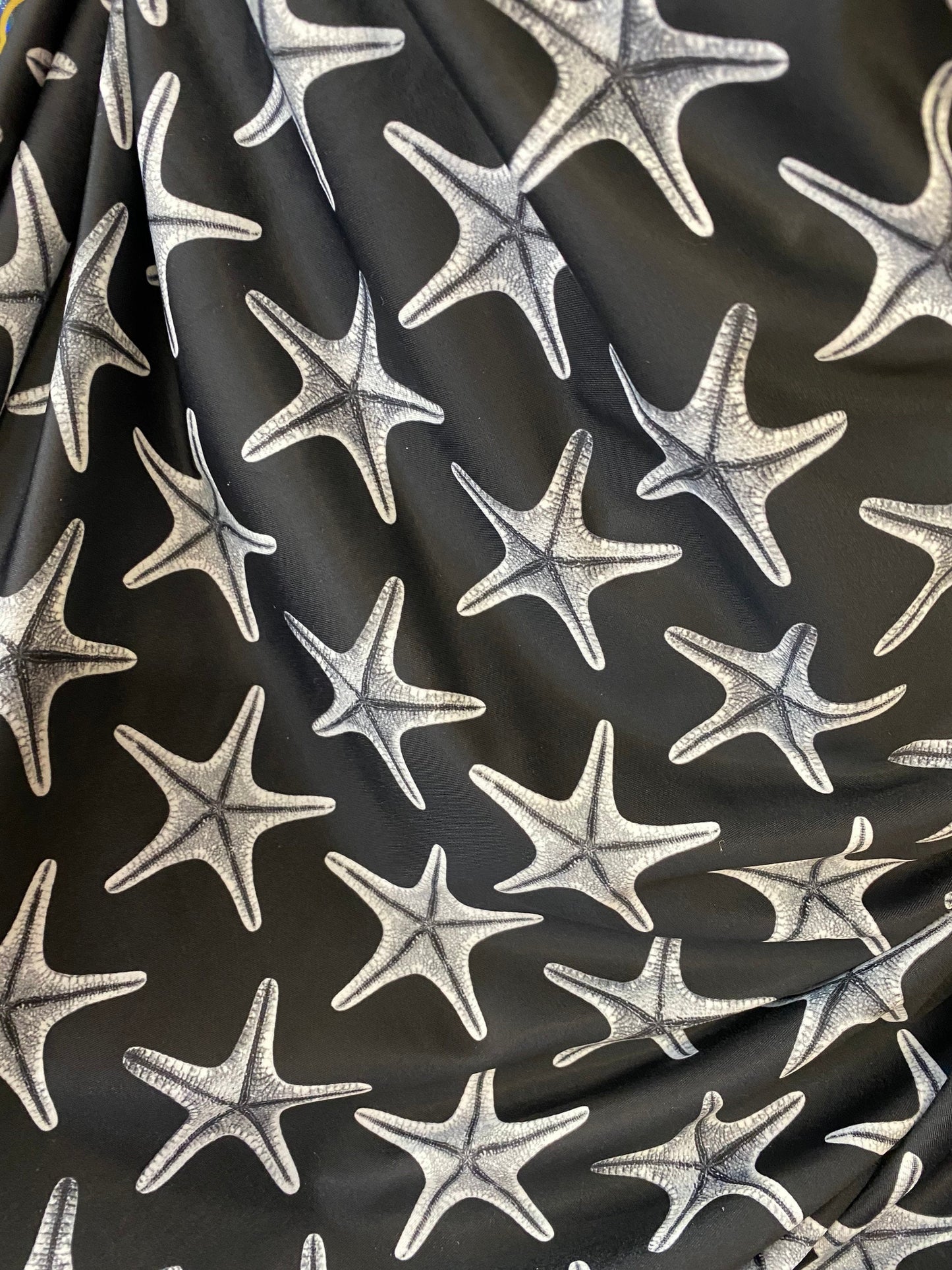 New starfish design print on nylon spandex 4-way stretch 58/60” Sold by the YD. Ships worldwide from Los Angeles California USA.