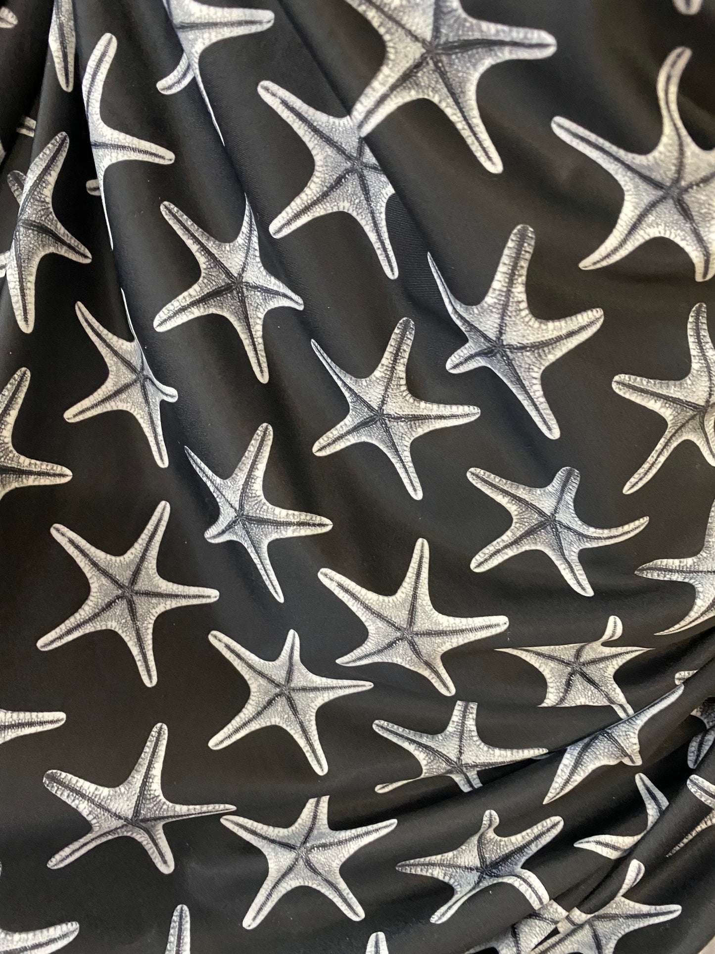 New starfish design print on nylon spandex 4-way stretch 58/60” Sold by the YD. Ships worldwide from Los Angeles California USA.