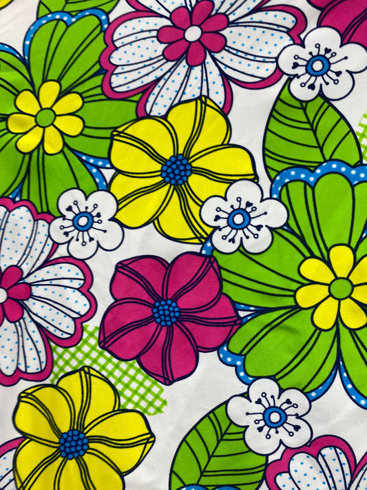 New Spring flower design white/multicolor print nylon spandex 4/way stretch 58/60” Sold by the YD. Ships worldwide from Los Angeles CA USA.