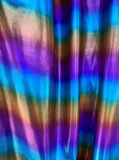 Rainbow all over foil nylon spandex 4-way stretch 58/60” Sold by the YD. Ships worldwide from Los Angeles California USA.