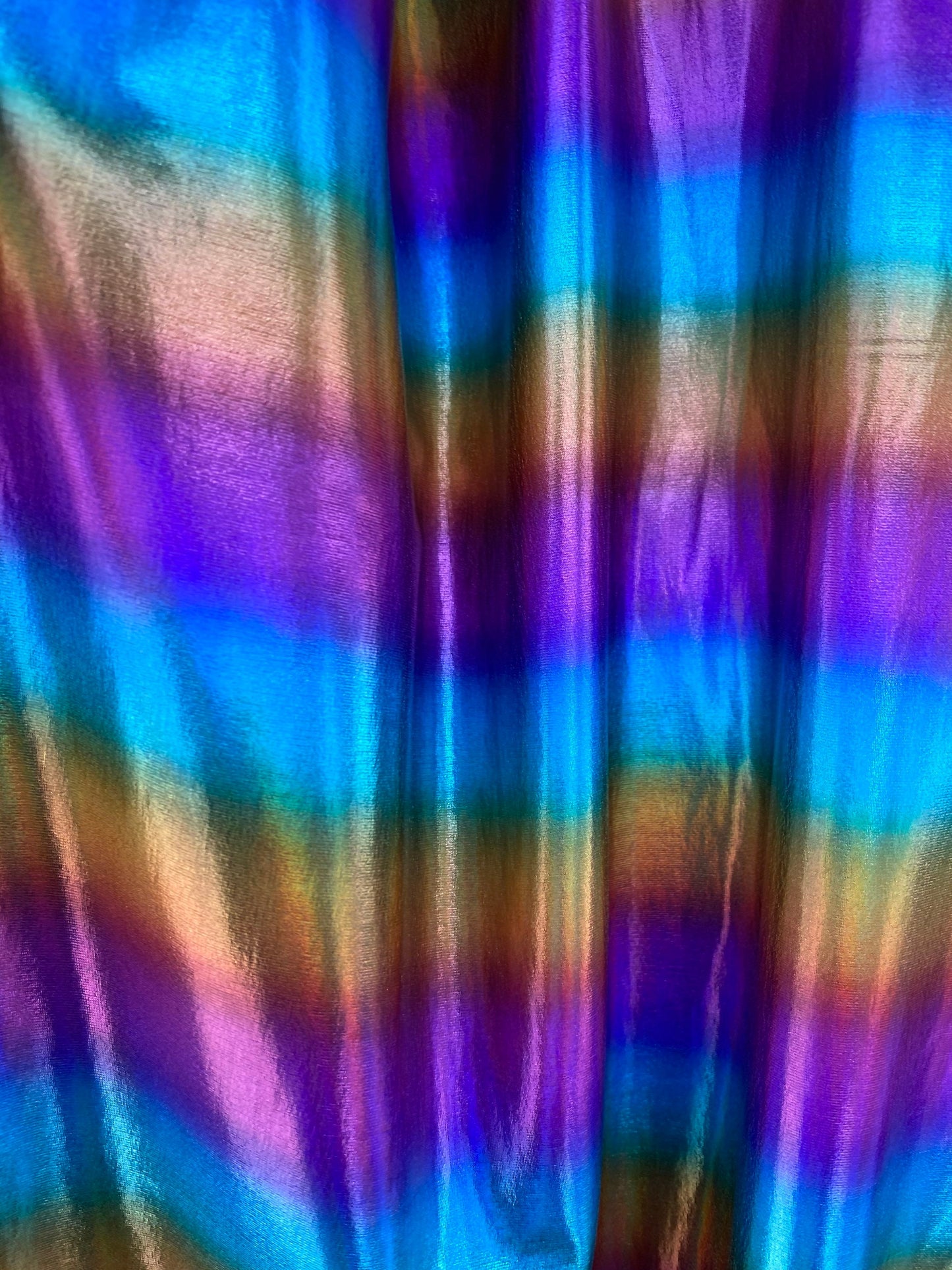 Rainbow all over foil nylon spandex 4-way stretch 58/60” Sold by the YD. Ships worldwide from Los Angeles California USA.