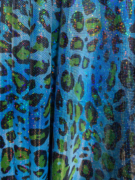Hologram exotic leopard design metallic nylon spandex 4-way stretch 58/60” Sold by the YD. Ships worldwide from Los Angeles California USA.