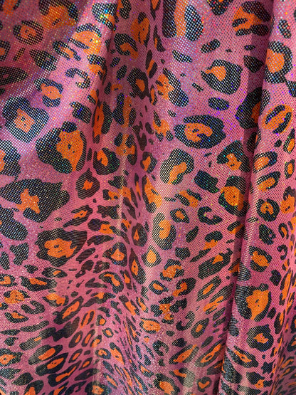 Hologram exotic leopard design metallic nylon spandex 4-way stretch 58/60” Sold by the YD. Ships worldwide from Los Angeles California USA.