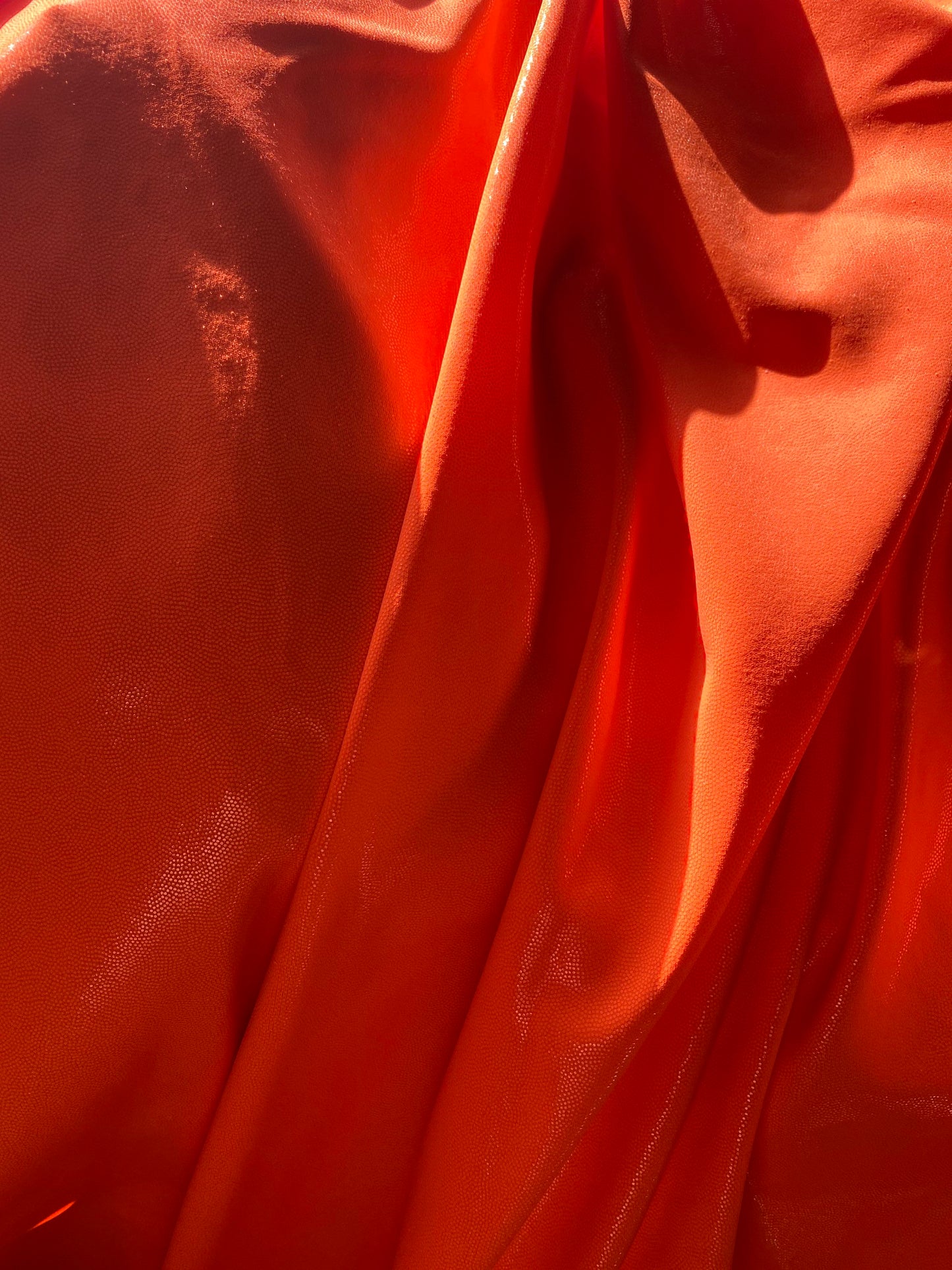 Neon Orange foggy foil nylon spandex 4-way stretch 58/60” Sold by the YD. Ships worldwide from Los Angeles California USA.
