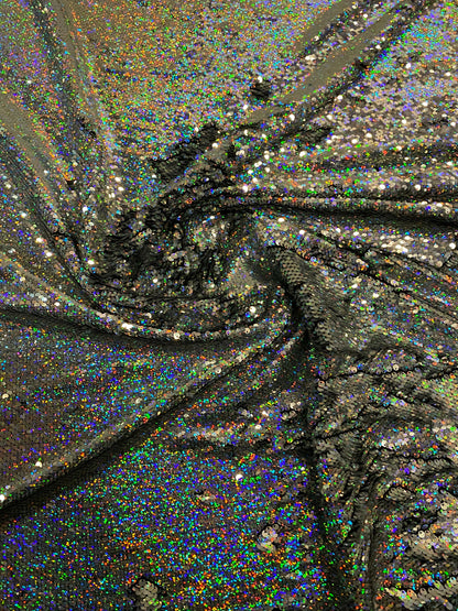 New hologram silver/silver reversible flip up sequins on spandex base 2-way stretch 58/60” Sold by the YD. Ships worldwide from Los Angeles