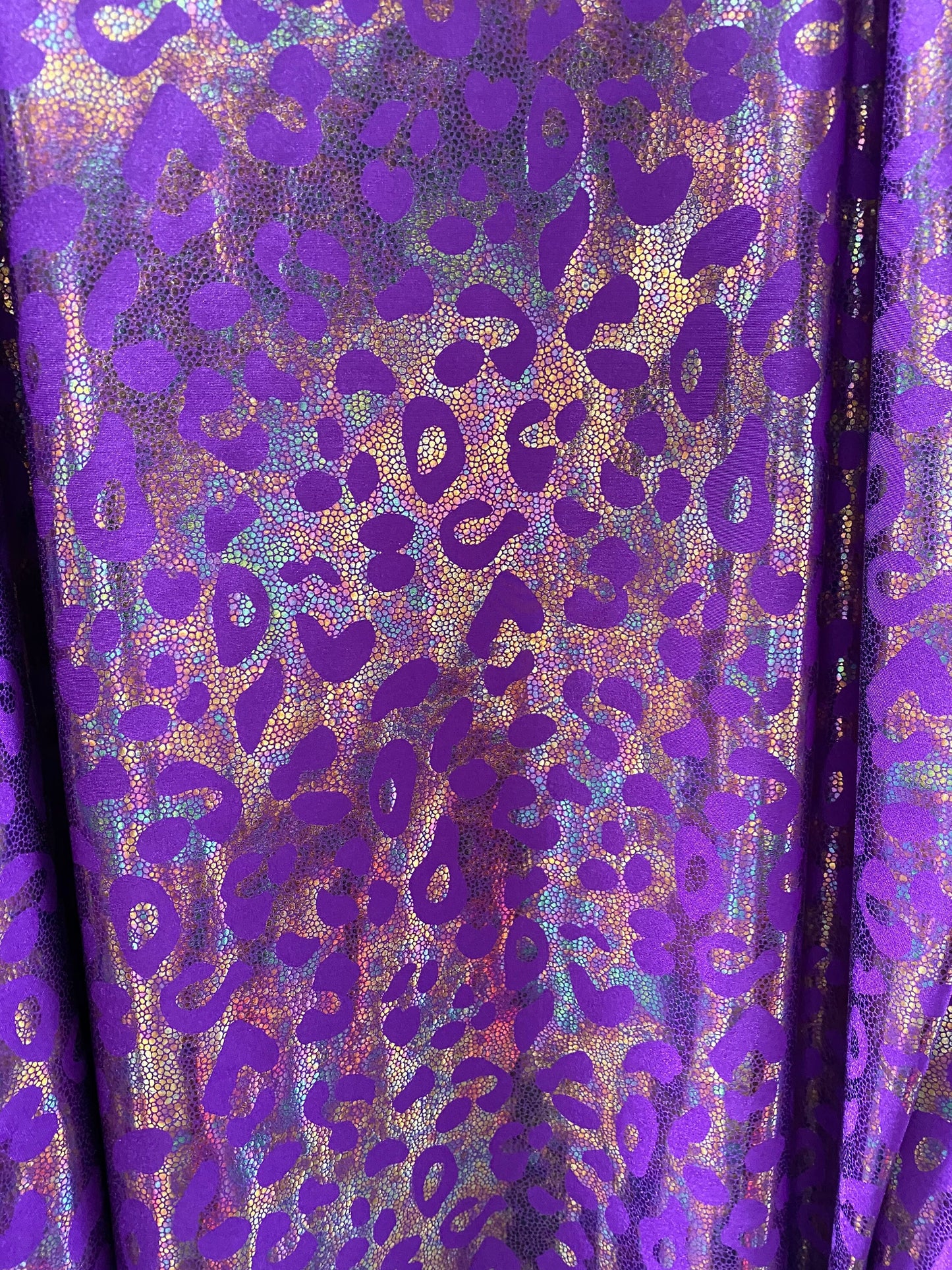 New exotic iridescent leopard design hologram nylon spandex 4-way stretch 58/60” Sold by the YD. Ships worldwide from Los Ángeles California