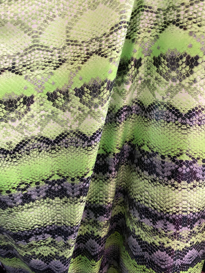 New neon green snake print on poly 4 way stretch spandex fabric 58/60” inch sold by the yard. Ships worldwide from Los Angeles California
