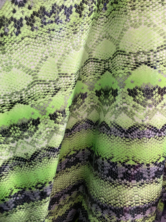 New neon green snake print on poly 4 way stretch spandex fabric 58/60” inch sold by the yard. Ships worldwide from Los Angeles California