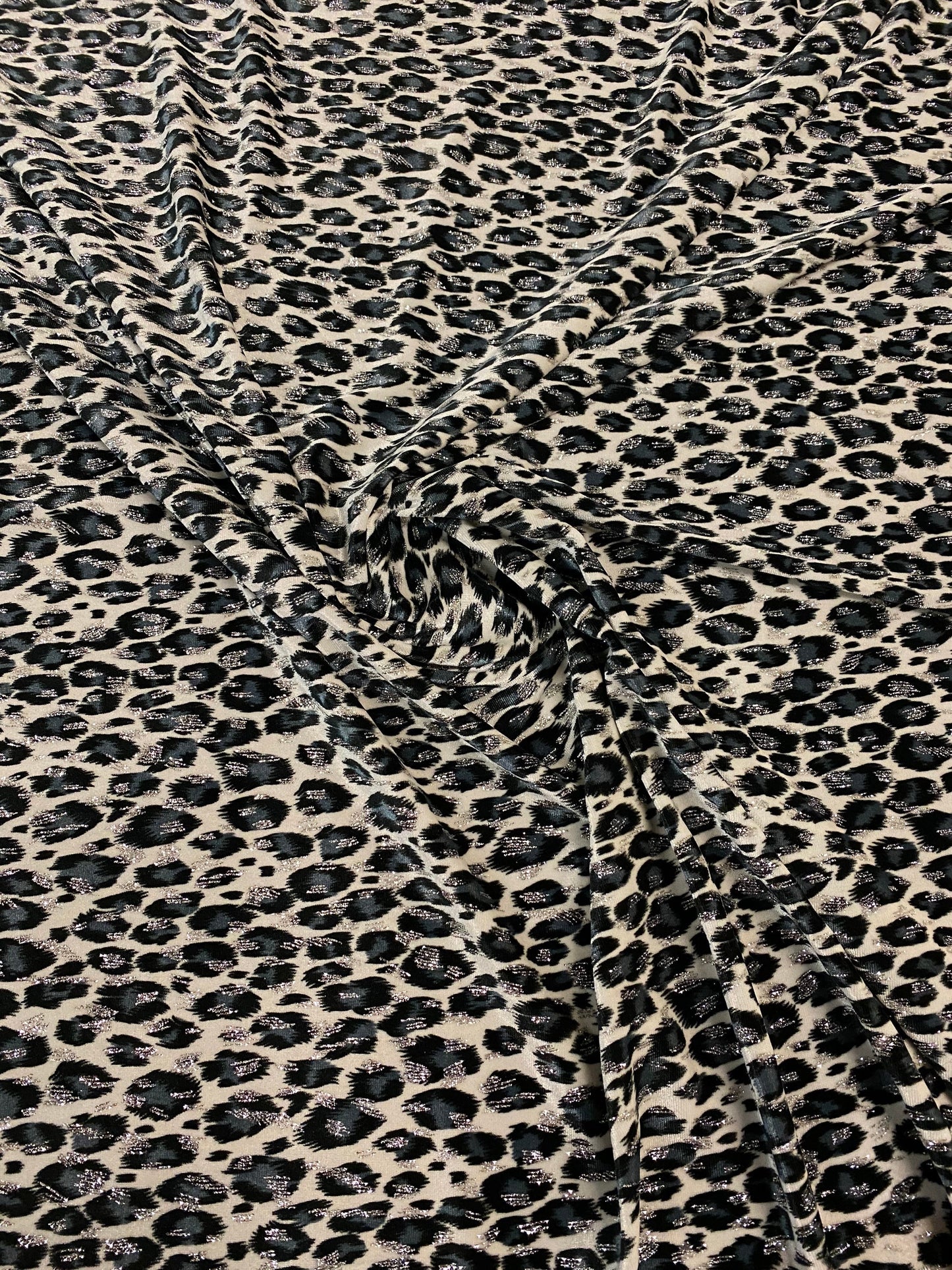 Leopard design with silver/glitter print on velvet 420gsm 4way stretch 58/60” Sold by the YD. Ships worldwide from Los Angeles California US