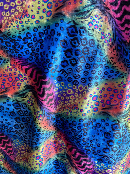 New Exotic multi animal print design multicolor print on stretch velvet 4way 58/60” Sold by the YD. Ships worldwide from Los Angeles CA USA.