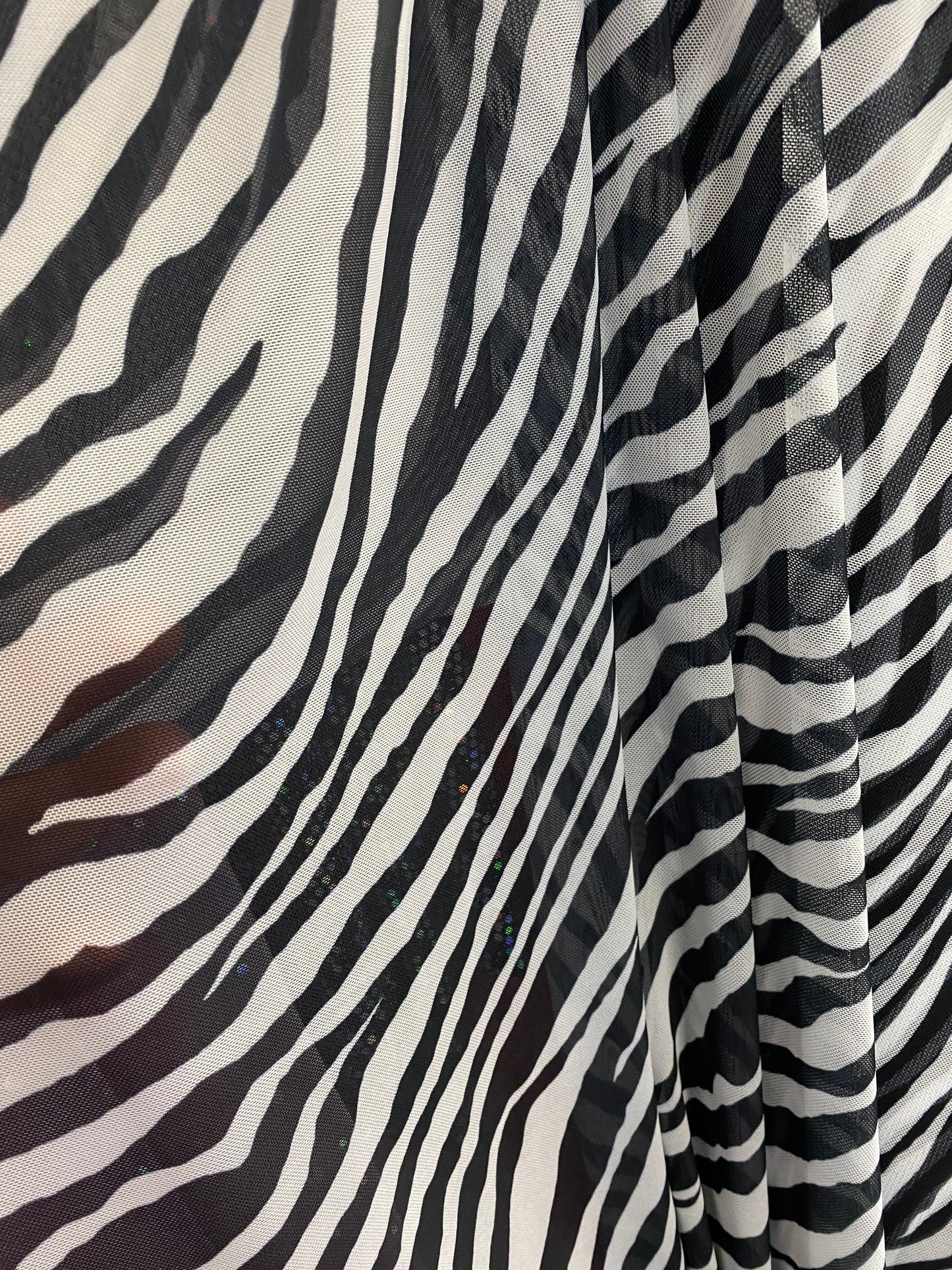 Zebra design exotic print on good quality of power mesh 4-way stretch 58/60” Sold by the YD. Ships worldwide from Los Angeles California USA