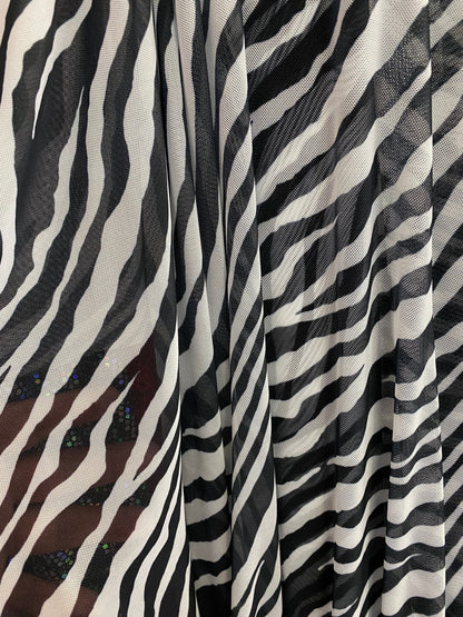 Zebra design exotic print on good quality of power mesh 4-way stretch 58/60” Sold by the YD. Ships worldwide from Los Angeles California USA