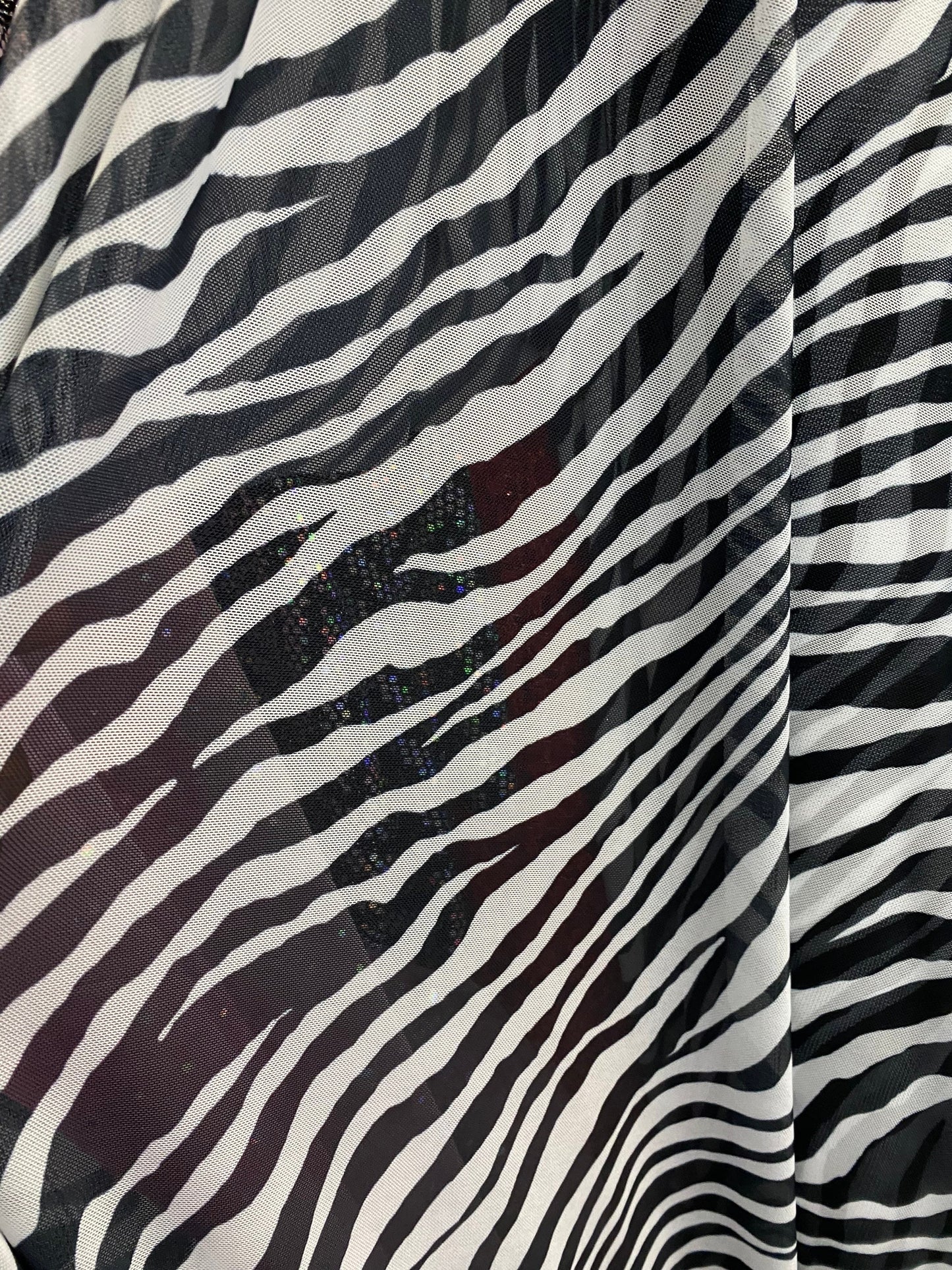 Zebra design exotic print on good quality of power mesh 4-way stretch 58/60” Sold by the YD. Ships worldwide from Los Angeles California USA